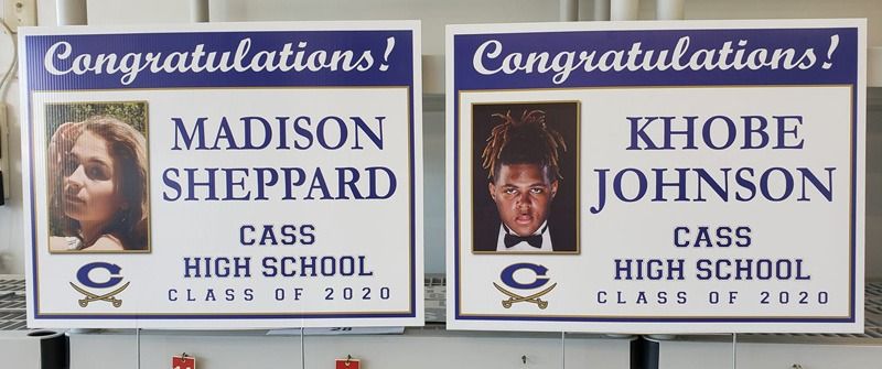 Graduation sign in purple lettering.